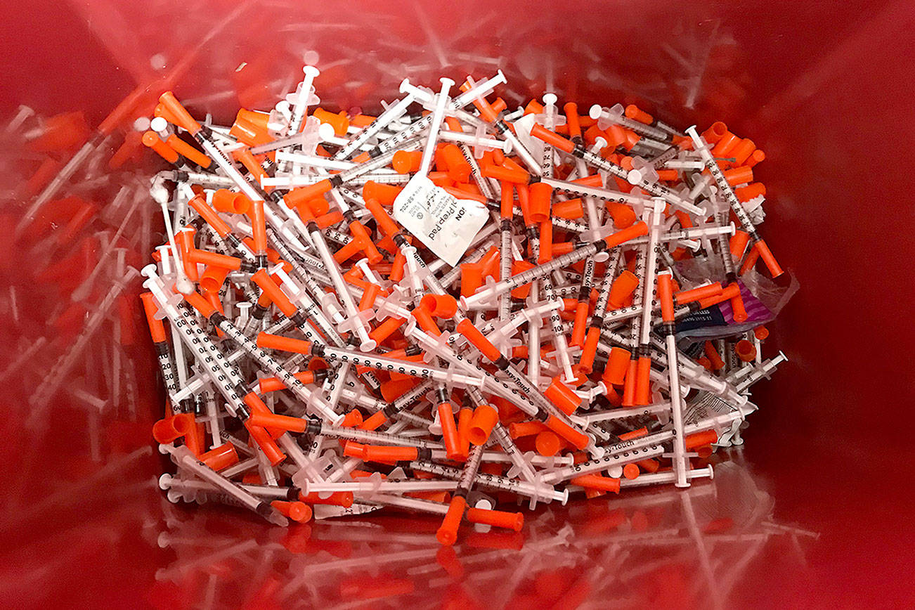 Louis Krauss | Grays Harbor News Group                                A bucket of used syringes disposed at Aberdeen’s needle exchange recently.