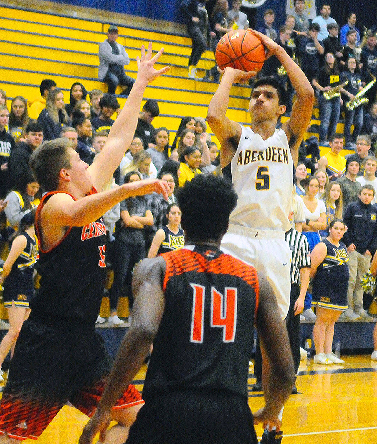 Aberdeen’s Javier Bojorge (5) pulls up for a mid-range jumper in the first quarter against Centralia on Friday. Bojorge led the Bobcats with 20 points in their 57-54 win over the Tigers. (Hasani Grayson | Grays Harbor News Group)