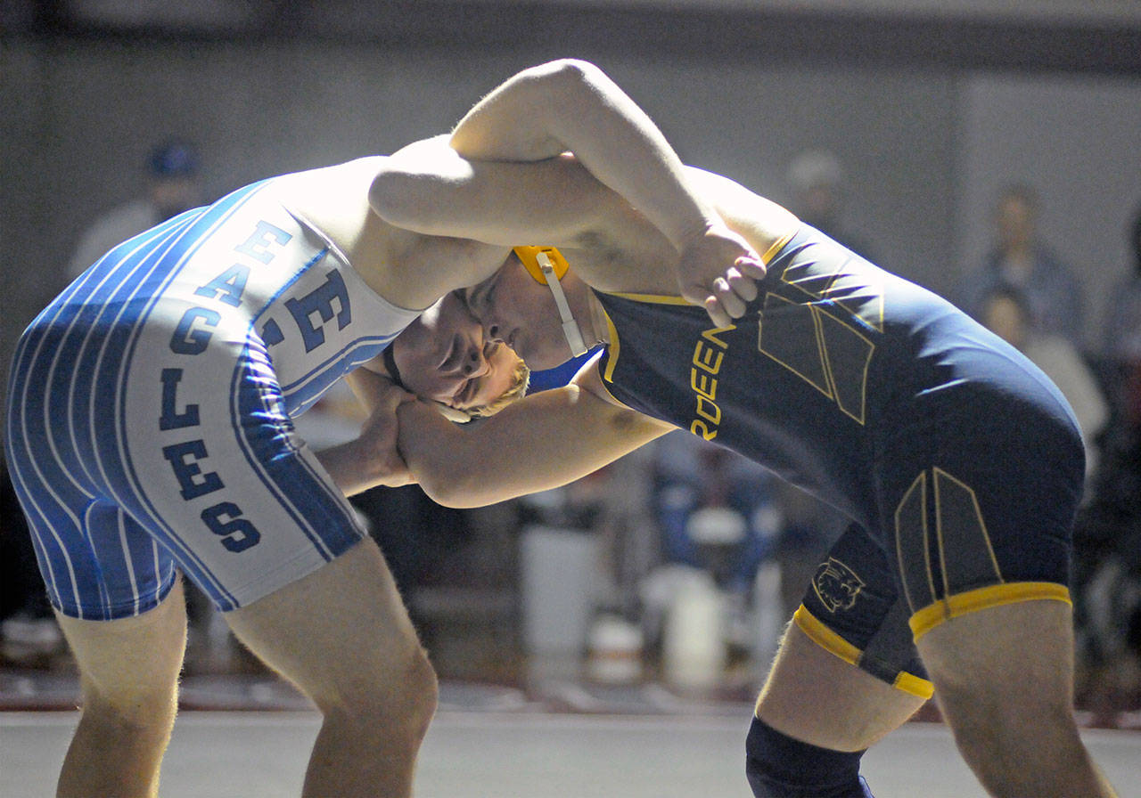 Elma’s Ben Bridge, left, grapples with Aberdeen’s Tyler Sherman in the 220-pound final of the 40th Annual Grizzly Alumni Invitational on Saturday in Hoquiam. (Ryan Sparks | Grays Harbor News Group)