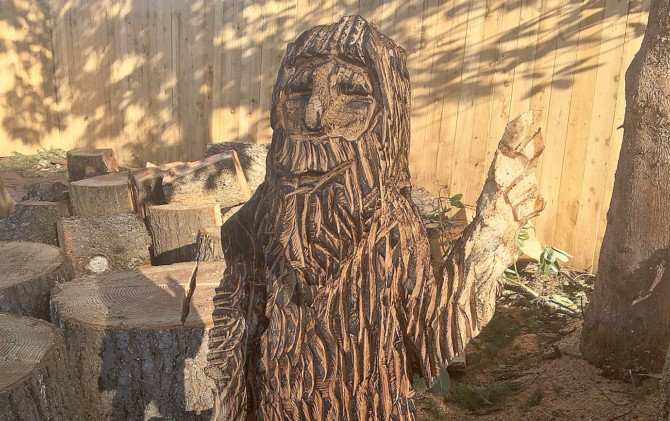DAN HAMMOCK | GRAYS HARBOR NEWS GROUP                                Sasquatch giving the peace sign, created by Thor, was one of the custom chainsaw carvings produced last weekend from trees blown down by the Port Orchard tornado in December.