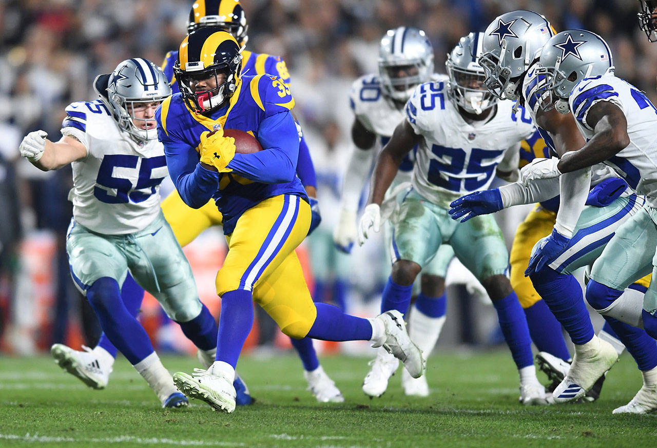 Los Angeles Rams running back C.J. Anderson picks up yards against the Dallas Cowboys in the first quarter during the NFL Divisional Round at the Los Angeles Memorial Coliseum on Saturday, Jan. 12, 2019. The Rams advanced, 30-22. (Wally Skalij/Los Angeles Times/TNS)