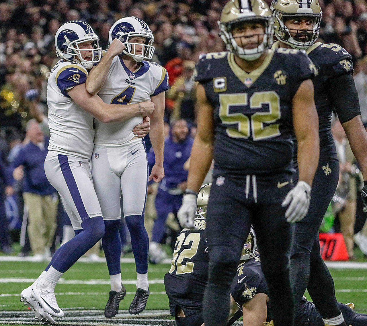 Los Angeles Rams kicker Greg Zuerlein is lifted by teammate Johnny Hekker after hitting a 57-yard field goal in overtime to beat the New Orleans Saints 26-23 in the NFC Championship game on Sunday, Jan. 20, 2019 at the Superdome in New Orleans, La. (Robert Gauthier/Los Angeles Times/TNS)