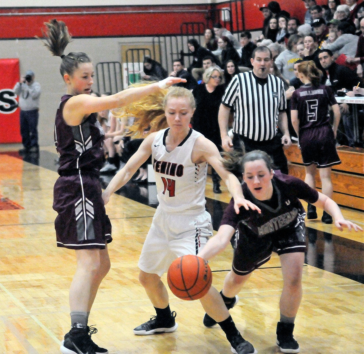 Montsano’s Lexi Lovell, right, steals the ball from Tenino’s Charlie Letts in the first quarter on Tuesday. Montesano had 11 steals in its 51-37 win over Tenino. (Hasani Grayson | Grays Harbor News Group)