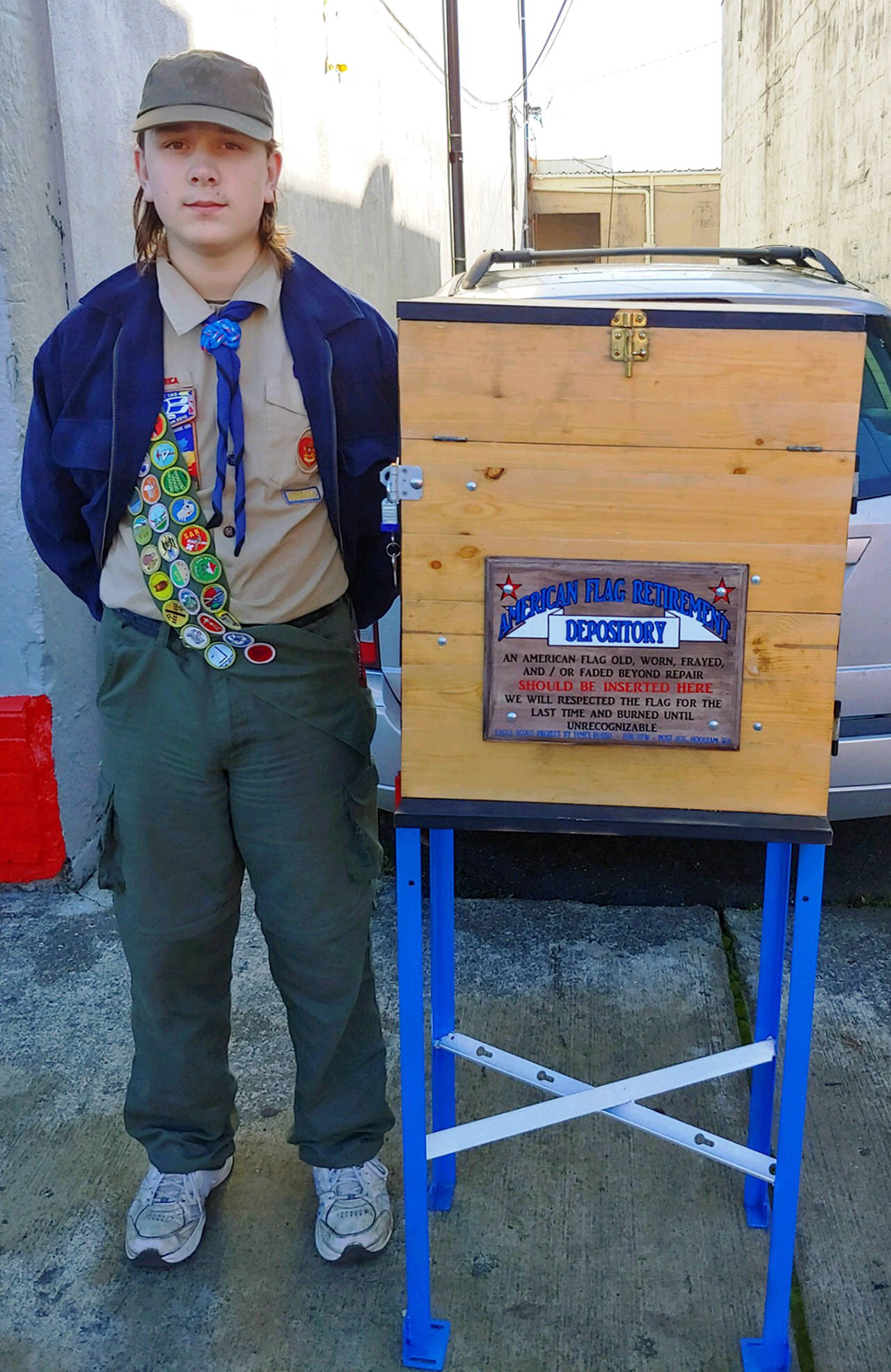 Photo courtesy Debra Rathbone                                James Russo of Troop 100 delivers his Eagle Scout project to the Hoquiam VFW.
