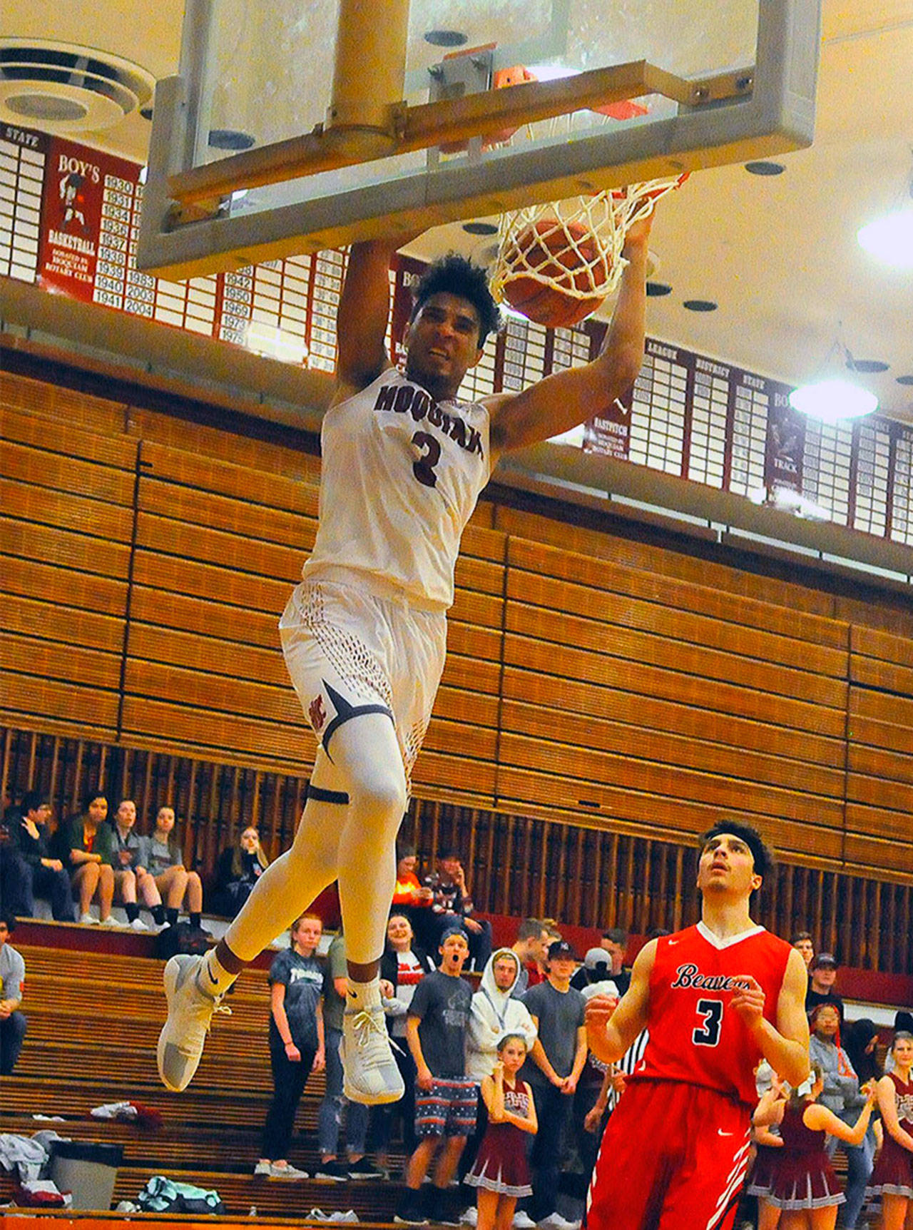 Hoquiam’s Rayyon Dayton, left, dunks in the fourth quarter against Tenino on Tuesday. Dayton led the Grizzlies with 13 points in Hoquiam’s 55-20 win over Tenino. (Hasani Grayson | Grays Harbor News Group)