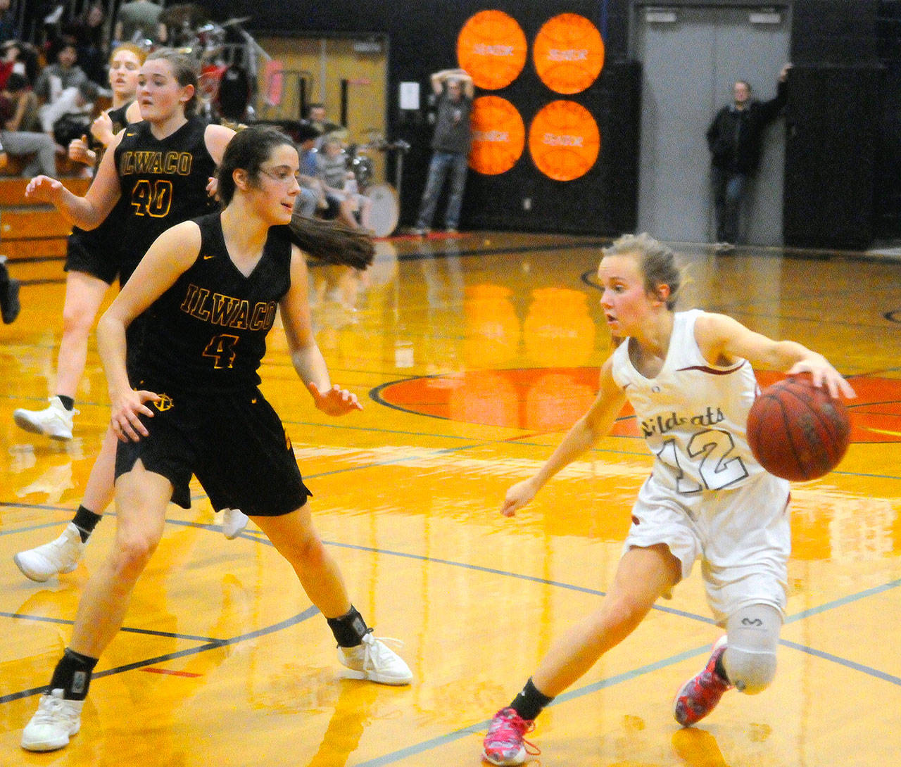 Ocostas Kjirstin Hopfer, right, looks to create room off the dribble while defended by Ilwacos Erika Glenn in the third quarter on Wednesday. Hopfer scored a team-best 17 points in Ocostas 56-53 overtime loss to Ilwaco. (Hasani Grayson | Grays Harbor News Group)