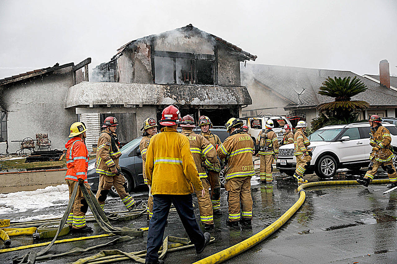 A home in Yorba Linda was destroyed by a plane crash that killed five people. (Marcus Yam/Los Angeles Times)
