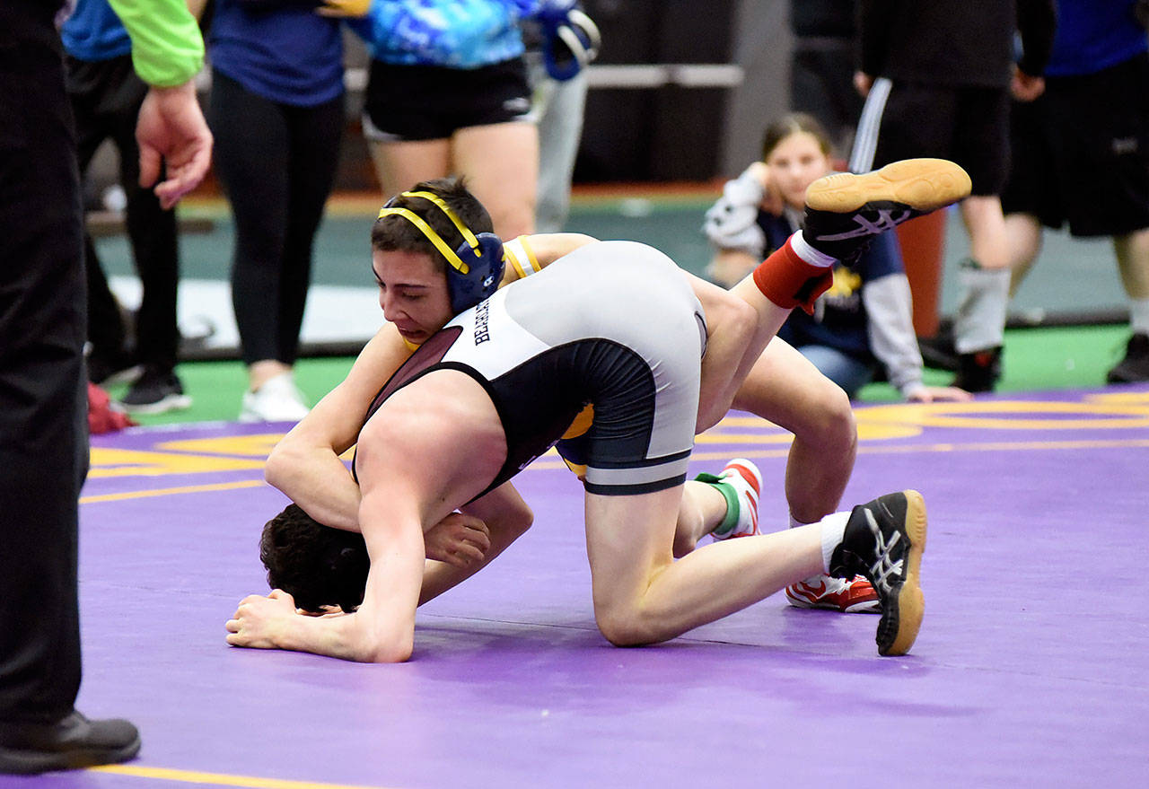 Aberdeen’s Caleb Lock, background, grapples with WF West’s Henry Robbins during the final match of the 106-pound weight class at the 2A District IV North Sub-Regional Tournament on Saturday in Centralia. Lock won via decision, 9-4. (Photo by Sue Michalak)