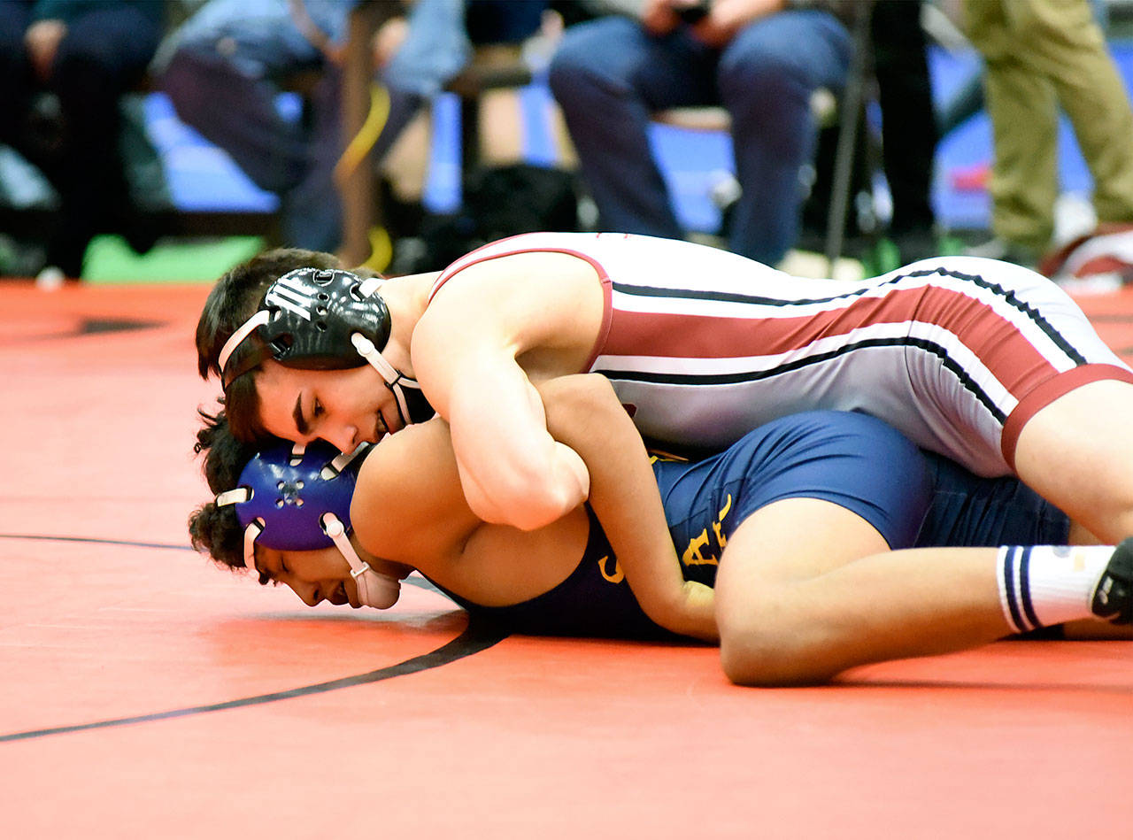 Hoquiam’s Malaki Eaton, top, locks up Forks’ Luis Perez in their 138-pound final match of the 2A District IV North Sub-Regional Tournament on Saturday in Centralia. Eaton won via fall at 3:53. (Photo by Sue Michalak)