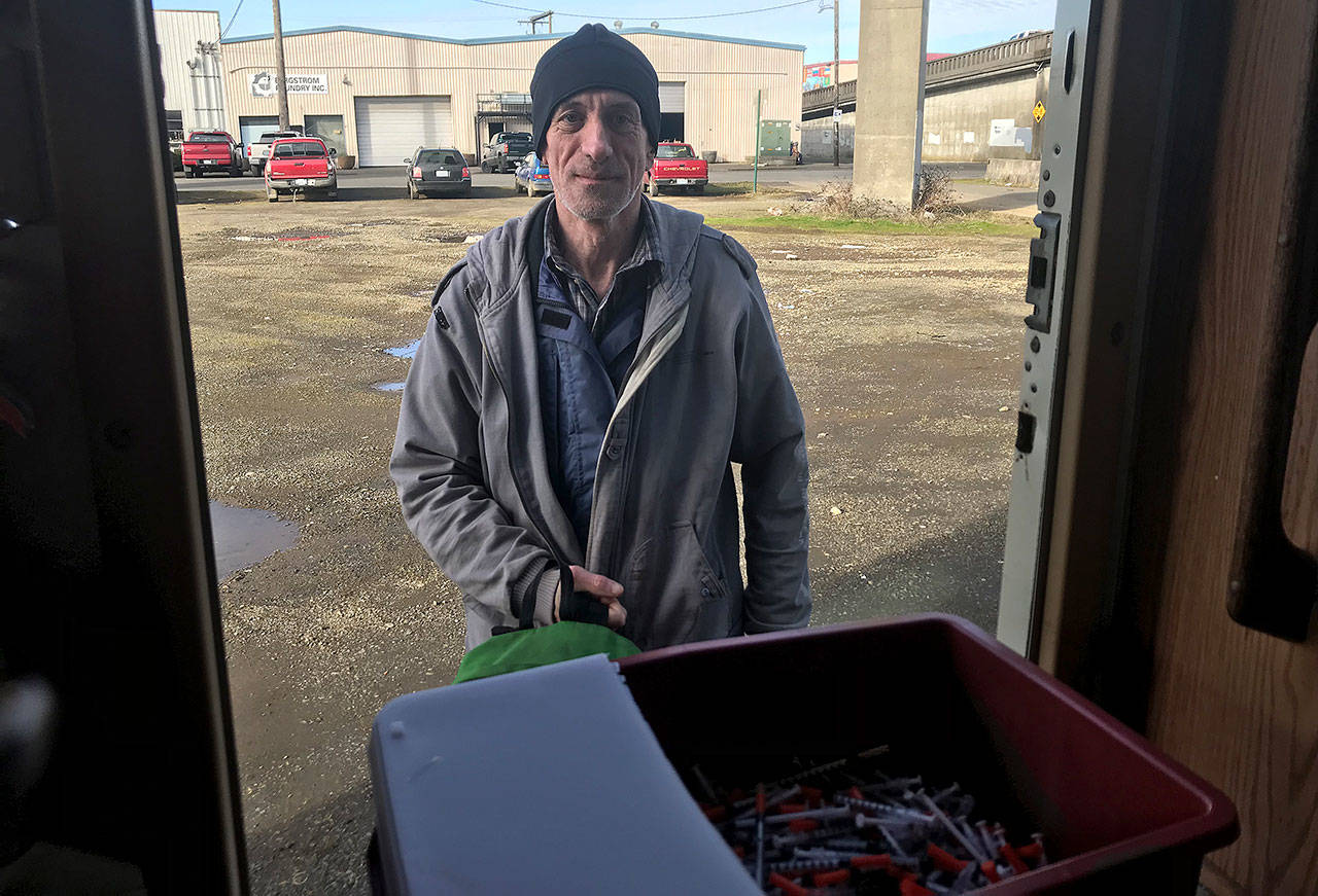 (Louis Krauss | Grays Harbor News Group) Jeff Simmons stands outside of the syringe exchange motorhome in downtown Aberdeen after discarding some needles.