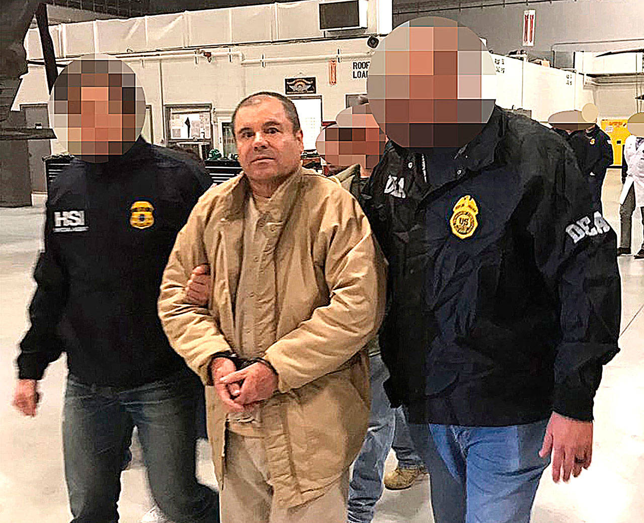 Drug lord Joaquin Guzman Loera, alias ‘El Chapo,’ as he is extradited to the United States on Jan. 19, 2017, and flown from a jail in Ciudad Juarez, Mexico, to Long Island MacArthur Airport in Islip, N.Y., to face charges. He was found guilty Tuesday by an anonymous jury in a unanimous verdict. (PGR/Prensa Internacional)