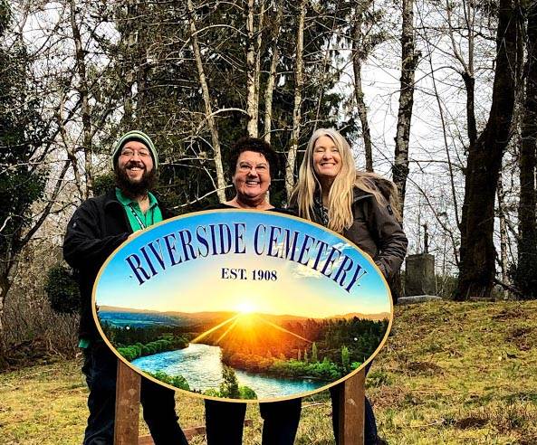 Showing off the new Riverside Cemetery sign are Matthew Shirley, Deborah Sturgill and Tina Kebow. (Jon Evers)
