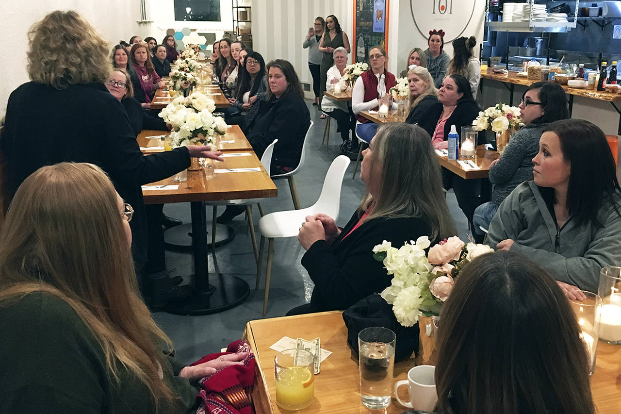 (Kat Bryant | Grays Harbor News Group) A packed house listens to Gloria Callaghan, executive director of the Domestic Violence Center of Grays Harbor.