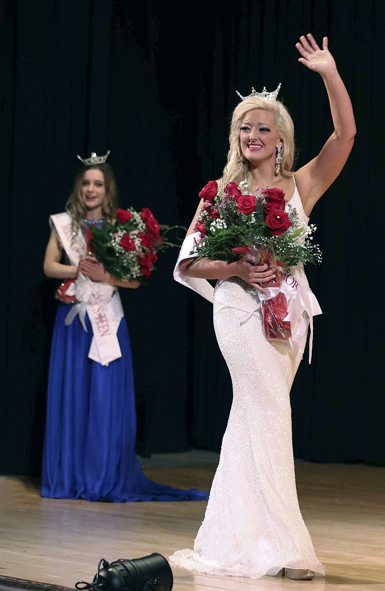 (Keith J. Krueger) Kuinn Karaffa waves after being crowned Miss Grays Harbor 2018. Behind her is Mercedes Morrill, winner of Grays Harbor Outstanding Teen 2018. They will be crowning their successors Saturday evening at the 7th Street Theatre.