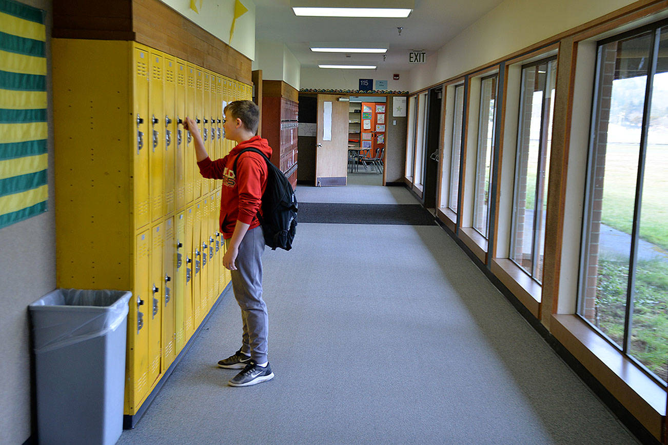 Louis Krauss | Grays Harbor News Group                                Student Hunter Eisele stands at his locker in Miller Junior High School in Aberdeen.