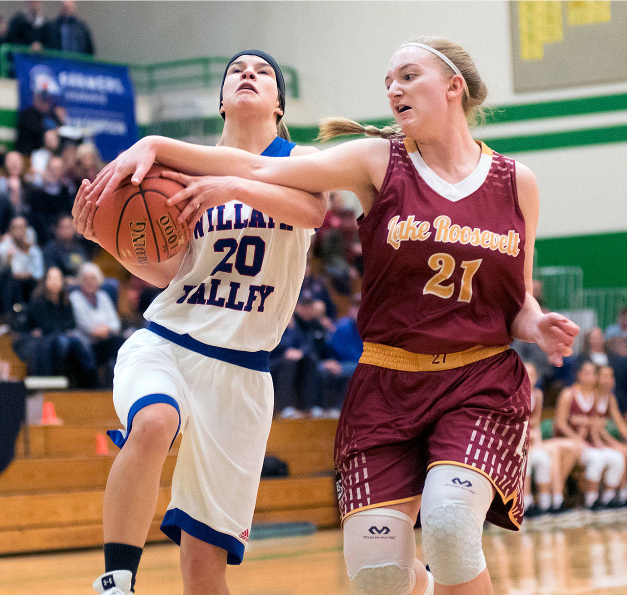 Willapa Valley’s Brooke Friese, left, is defended by Lake Roosevelt’s Kelsie Olbricht during the Vikings’ 44-35 win in the 2B Regional Playoffs on Friday. Friese scored a team-high 18 points in the contest. (Matt Baide | The Chronicle)