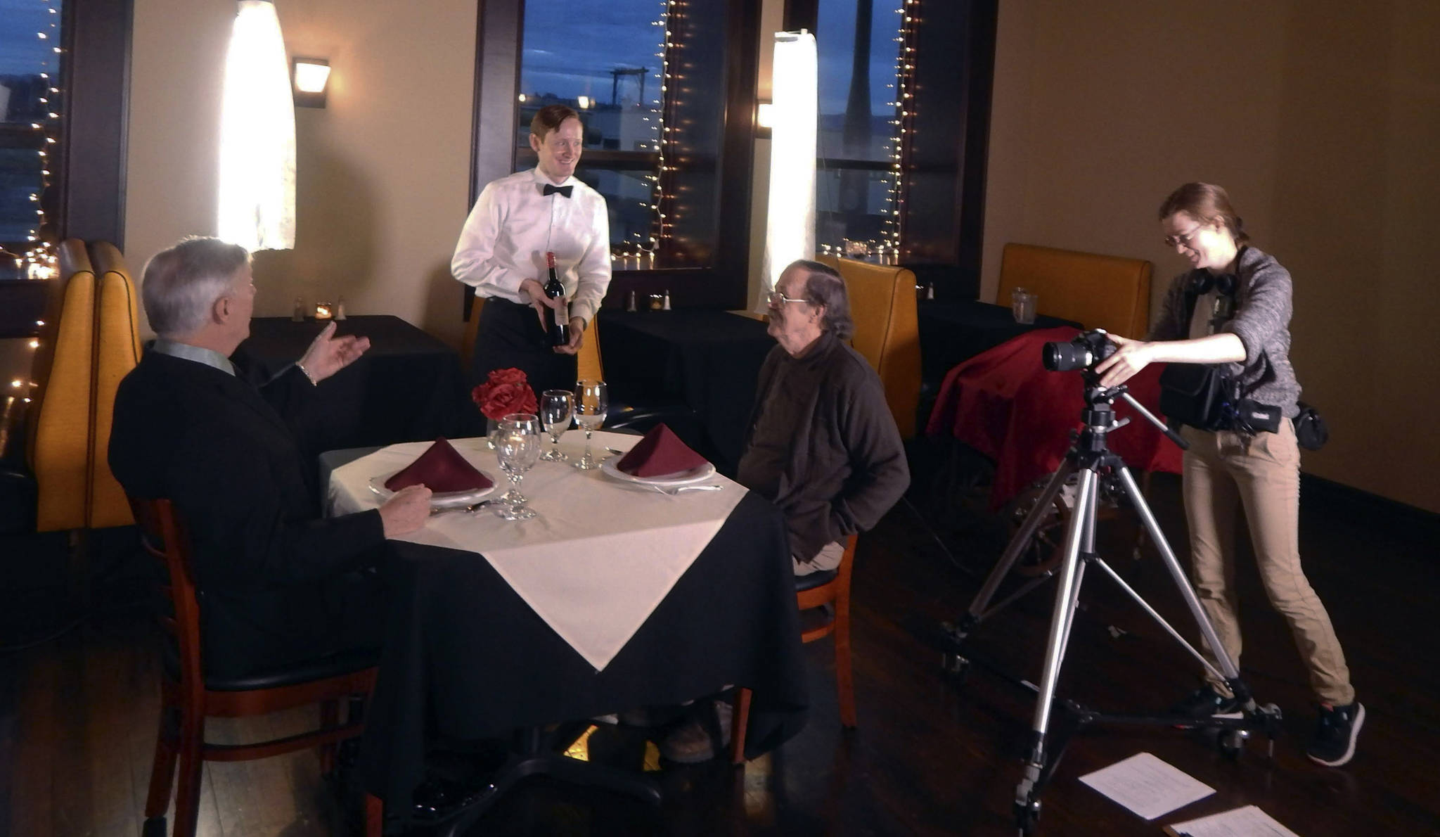 (Courtesy photo) Aria films a scene at the former Cortese’s restaurant in Aberdeen, with Cal Hastings (played by Russell Wiitala), left, and Frank Blakely (Bob Parks) being served by JR Morgan as the waiter.