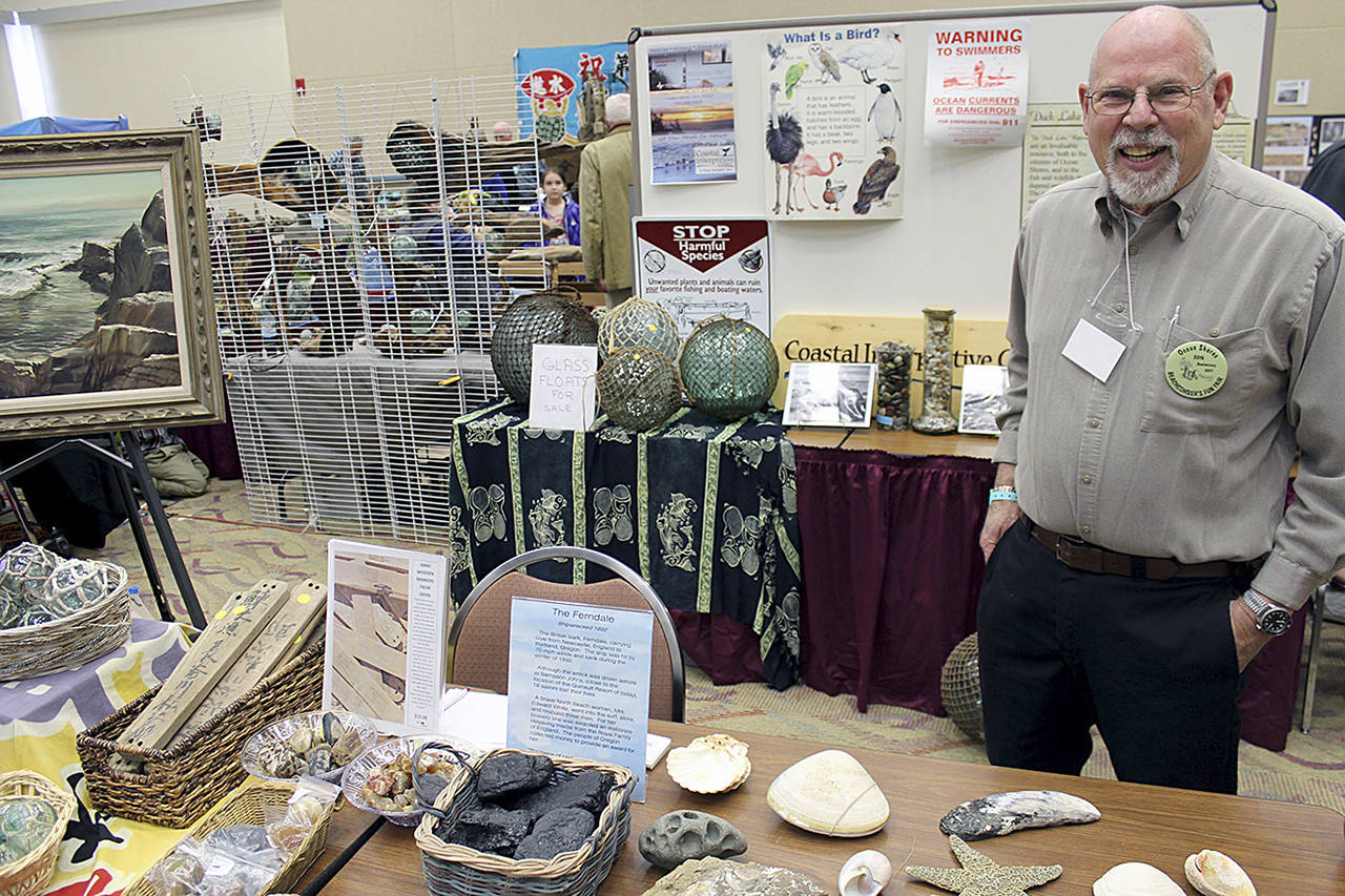 (Angelo Bruscas | Grays Harbor News Group) A Coastal Interpretive Center docent explains some of the beachcombed items on display at a past Beachcombers Fun Fair. The center always has a very informative display during the annual event, to be held this weekend at the Ocean Shores Convention Center.