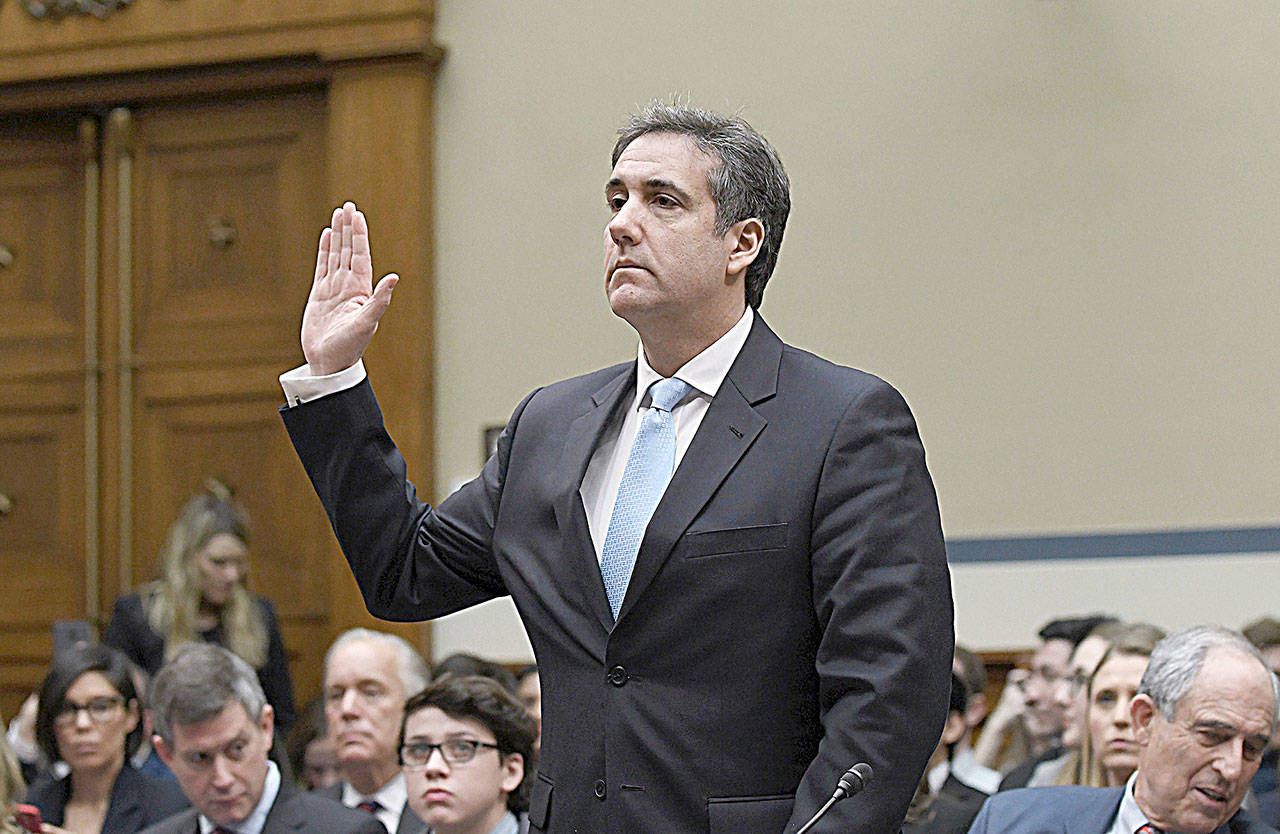 Michael Cohen, former attorney for U.S. President Donald Trump, is sworn in before testifying before the House Oversight and Reform Committee in the Rayburn House Office Building on Capitol Hill in Washington, D.C. on Wednesday. (Olivier Douliery/Abaca Press)