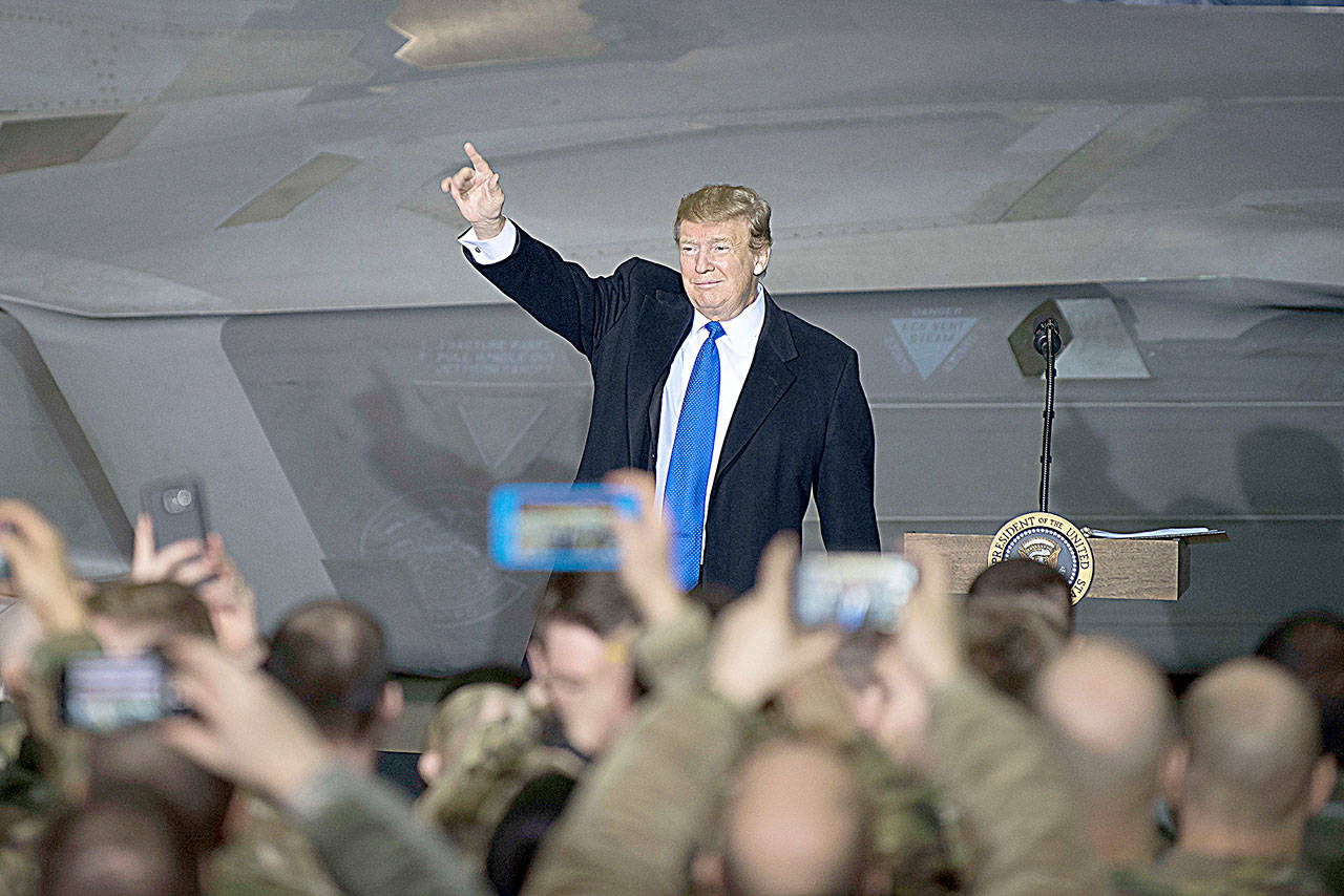 President Donald Trump addresses service members during a refuelling stop at Joint Base Elmendorf-Richardson in Fairbanks, Alaska. The President stopped briefly on the return flight from the North Korean summit in Vietnam. (Westin Warburton/ZUMA Wire)