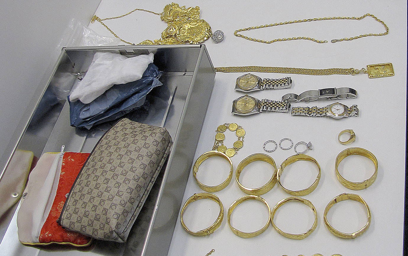 COURTESY GRAYS HARBOR DRUG TASK FORCE                                 Gold, jade and diamond jewelry and high-end watches including Rolexes were among the personal property seized during the Green Jade illegal marijuana growing operations busts in late 2017.