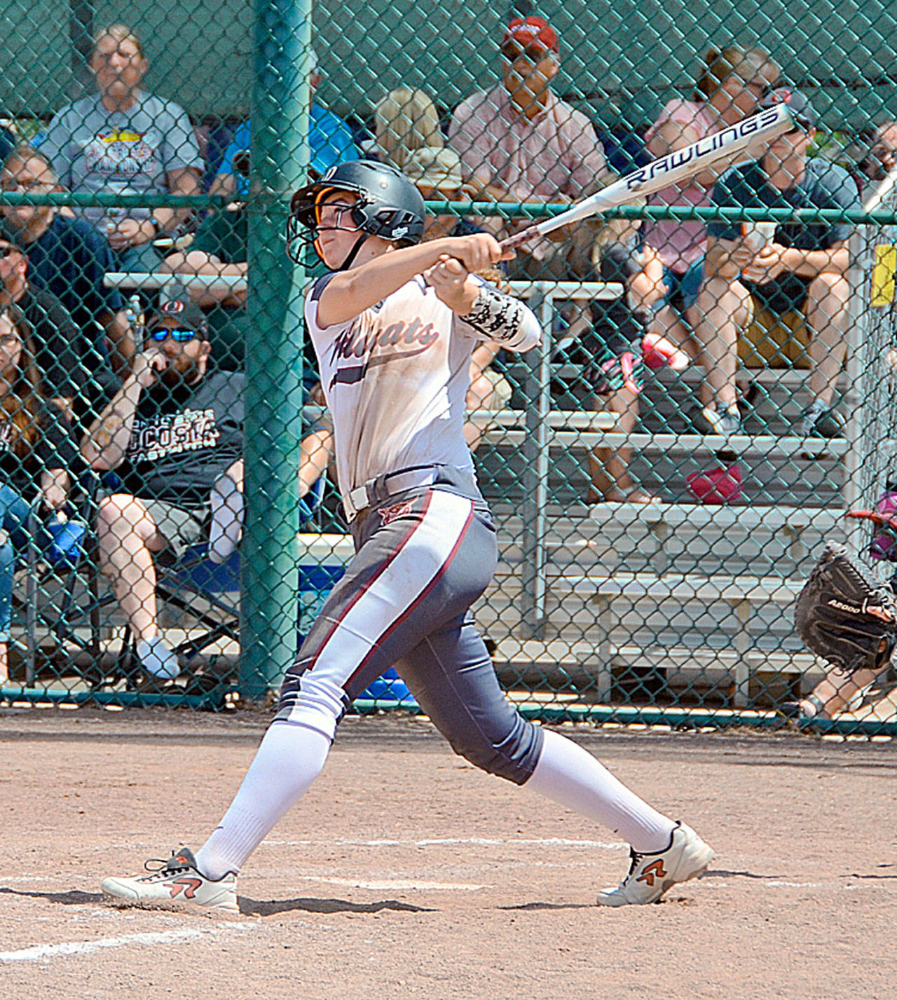 Ocosta’s reigning 2B Pacific League MVP, Kaylee Barnum, sends a base hit to left field during the 1B State Championship tournament in Yakima last season. (Photo by Michael Pedersen)