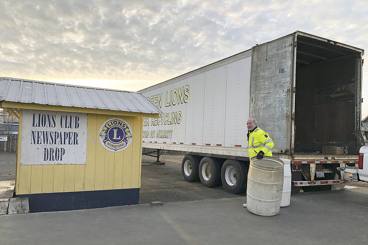 (Courtesy photo) Aberdeen Lion Harold Burnett returns bins to the paper shack after they’ve been emptied into the trailer.
