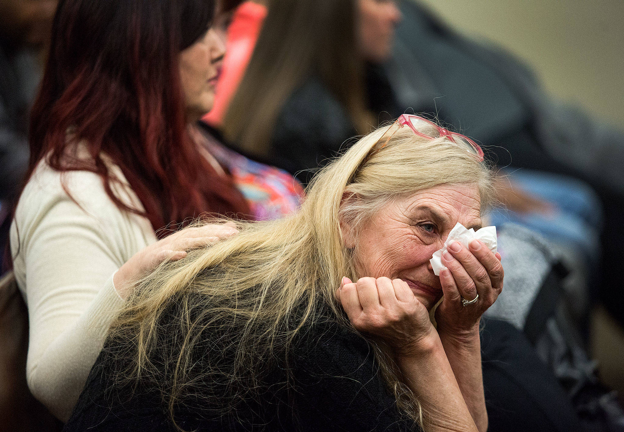 Beth Hynek reacts as family members talks about Julie Knetchel, an Everett mother who was shot to death while trying to protect her son from armed intruders. (Andy Bronson / The Herald)