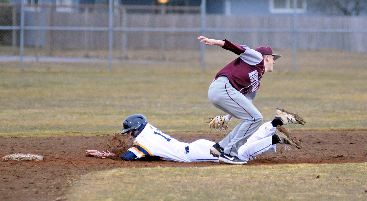 Aberdeen’s Christian Fraley slides in safely ahead of the tag of Montesano’s Braden Dohrmann during Montesano’s 15-3 win at Jack Waite Field on Thursday. (Ryan Sparks | Grays Harbor News Group)