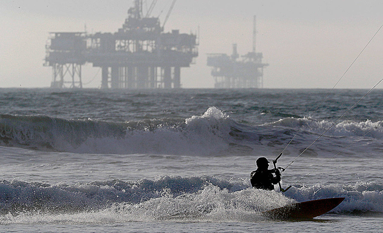 Offshore oil drilling platforms along the California coastline in Huntington Beach. President Trump is laying the groundwork to limit states’ say in offshore drilling plans. (Luis Sinco/Los Angeles Times)
