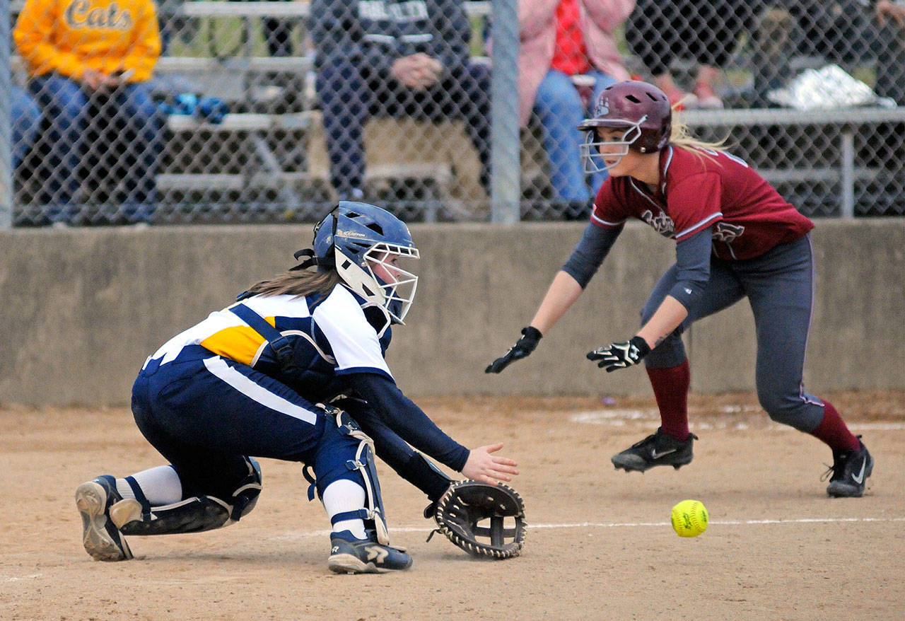 Hoquiam’s Maya Jump, right, slides in ahead of the tag from Aberdeen catcher Sierra Hammond during the Grizzlies’ 5-1 win on Thursday. (Ryan Sparks | Grays Harbor News Group)
