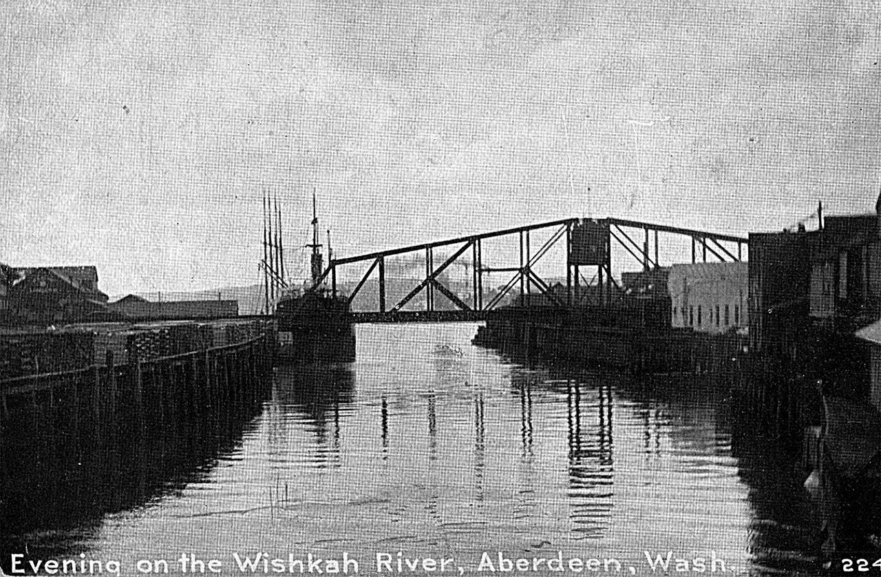 A photo from 110 years ago, when the Northern Pacific railroad bridge across the Wishkah River was new. This photo was taken looking south from the second Heron Street Bridge which opened in 1905. On the east side of the Wishkah River is the S.E. Slade Lumber Mill (present-day site of the Best Western Motel). The building with the peaked roof visible on the extreme right was the office of the Sailor’s Union of the Pacific with the notorious Billy Gohl serving as the local agent at the time of this photo. (Roy Vataja Collection)