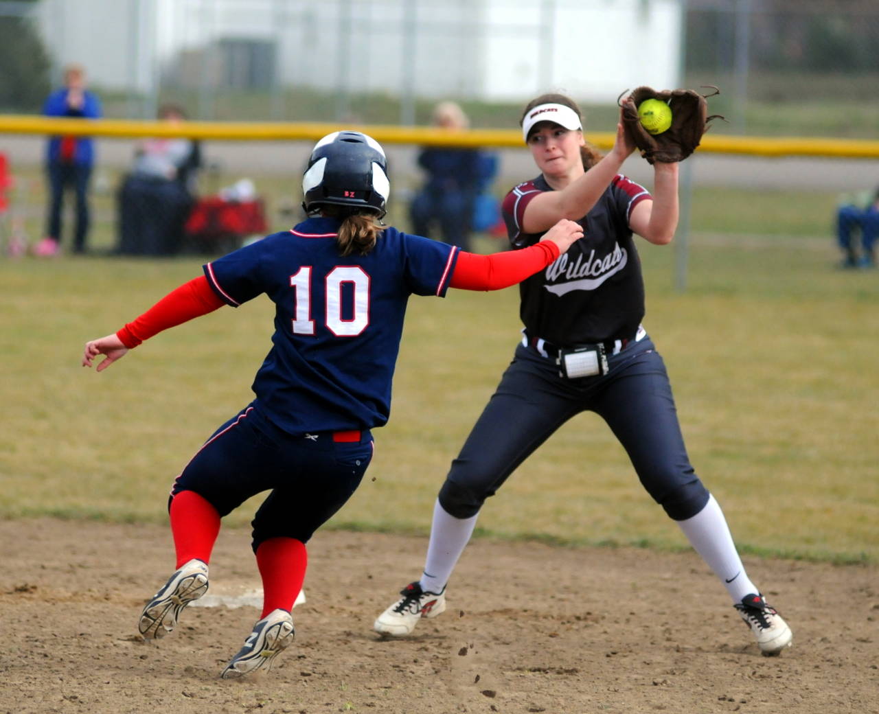 Ocosta infielder Kaylee Barnum, right, looks to tag PWV’s Morgan Coady during a doubleheader on Saturday at Pe Ell High School. (Ryan Sparks | Grays Harbor News Group)