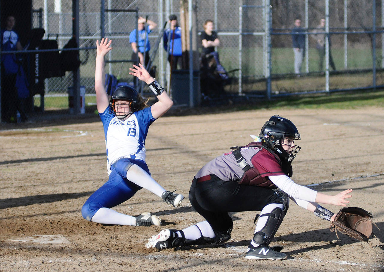 Elma’s Quin Mikel slides into home plate in the fourth inning while Montesano catcher Kate Klinger defends in the Eagles’ 6-5 win on Tuesday. (Hasani Grayson | Grays Harbor News Group)