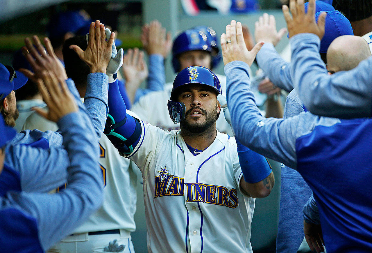Seattle Mariners catcher Omar Narvaez celebrates his three-run home run in the third inning against the Boston Red Sox on Sunday, March 31, 2019 at T-Mobile Park in Seattle, Wash. (Ken Lambert/Seattle Times/TNS)