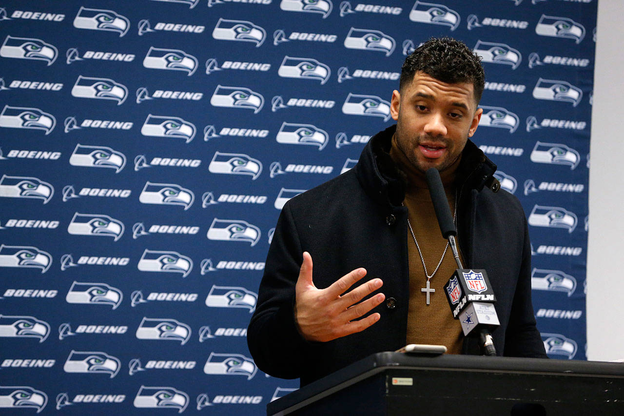 Seattle Seahawks quarterback Russell Wilson, seen here in a file photo from January, gave the club an April 15 deadline to negotiate a new contract, according to a source. (AP Photo/Michael Ainsworth)