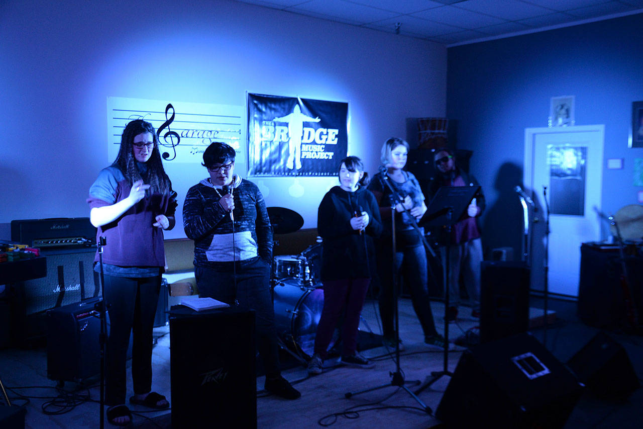 photos by Louis Krauss | Grays Harbor News Group                                From left, Teyah Johnson, Eren Swift, Alyssa Keck, Jennifer Valentine and Arty Shaw rehearse their rock band at the Bridge Music Project workshop. These students and others will put on a free public concert at 7 p.m. Friday at the Garage in Aberdeen.