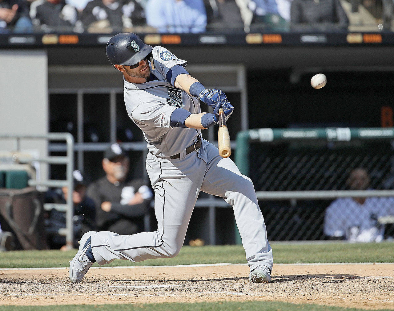 The Seattle Mariners’ Mitch Haniger hits a two-run home run in the sixth inning against the Chicago White Sox at Guaranteed Rate Field in Chicago on Friday, April 5, 2019. The White Sox won, 10-8. (Jonathan Daniel/Getty Images/TNS)
