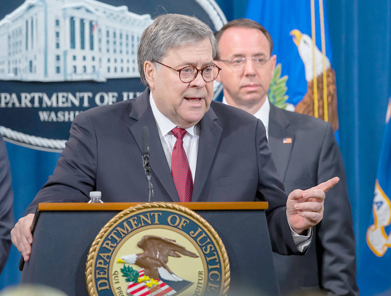 U.S. Attorney General William Barr, left, and Deputy Attorney General Rod Rosenstein hold a press conference at the U.S. Department of Justice on Thursday in Washington, D.C. The briefing came just before the release of a redacted version of Special Counsel Robert Mueller’s report on Russian interference in the 2016 election. (Sipa USA/TNS)