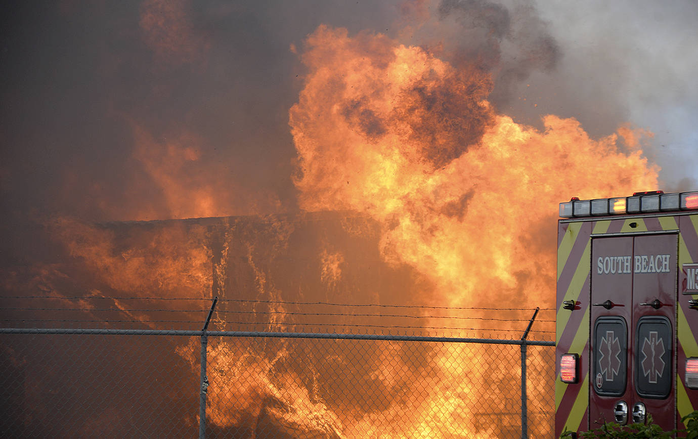 DAN HAMMOCK | GRAYS HARBOR NEWS GROUP                                Flames consume the Coast Seafood processing plant off State Route 105 behind the Ocean Spray plant Tuesday afternoon.