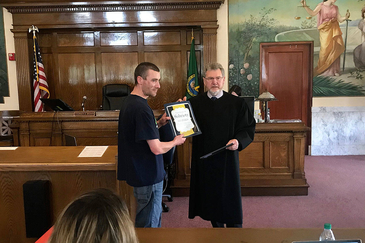 Louis Krauss | Grays Harbor News Group                                Brice Woods receives an award for 365 days sober in the Grays Harbor County drug court program.