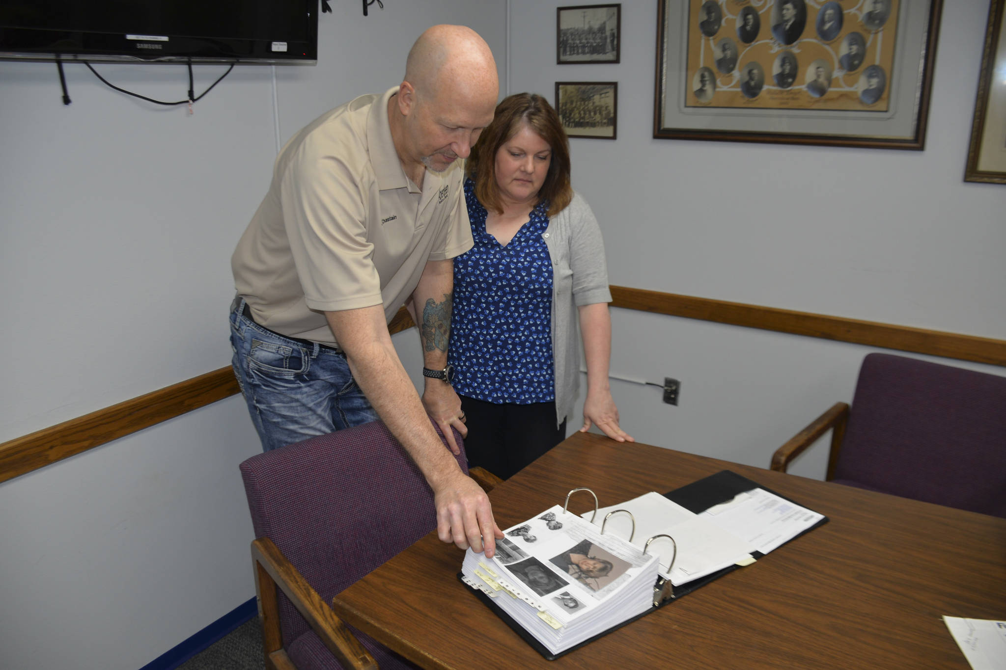 DAN HAMMOCK | GRAYS HARBOR NEWS GROUP                                Aberdeen Police Lt. C.J. Chastain and Det. Kristi Lougheed look through the case file of Laura Flink, who disappeared from Aberdeen 50 years ago. Flink’s remains have never been found.