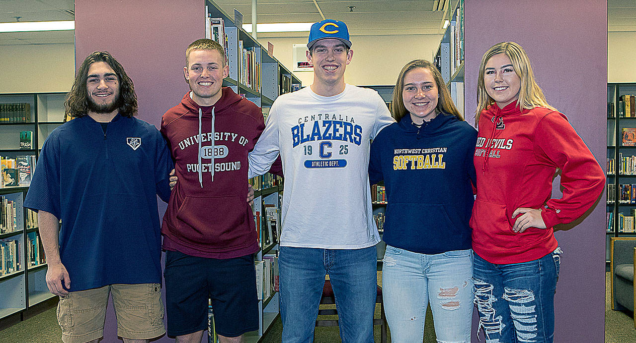 Five Montesano student-athletes are moving on to play at the collegiate level after the school held a National Letter of Intent signing ceremony on April 19. From left: Teegan Zillyett (Big Bend College, baseball), Payson Parker (University of Puget Sound, golf), Evan Bates (Centralia College, baseball), Katie Granstrom (Northwest Christian University, softball) and Lindsay Pace (Lower Columbia College, softball). (Photo by Shawn Donnelly)