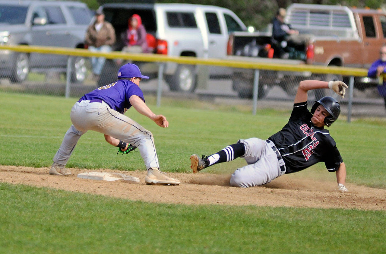 Ocosta’s Cole Hatton, right, is tagged out at second base after trying to advance on a pop out in a 2B District IV playoff game against Onalaska on Saturday. (Ryan Sparks | Grays Harbor News Group)