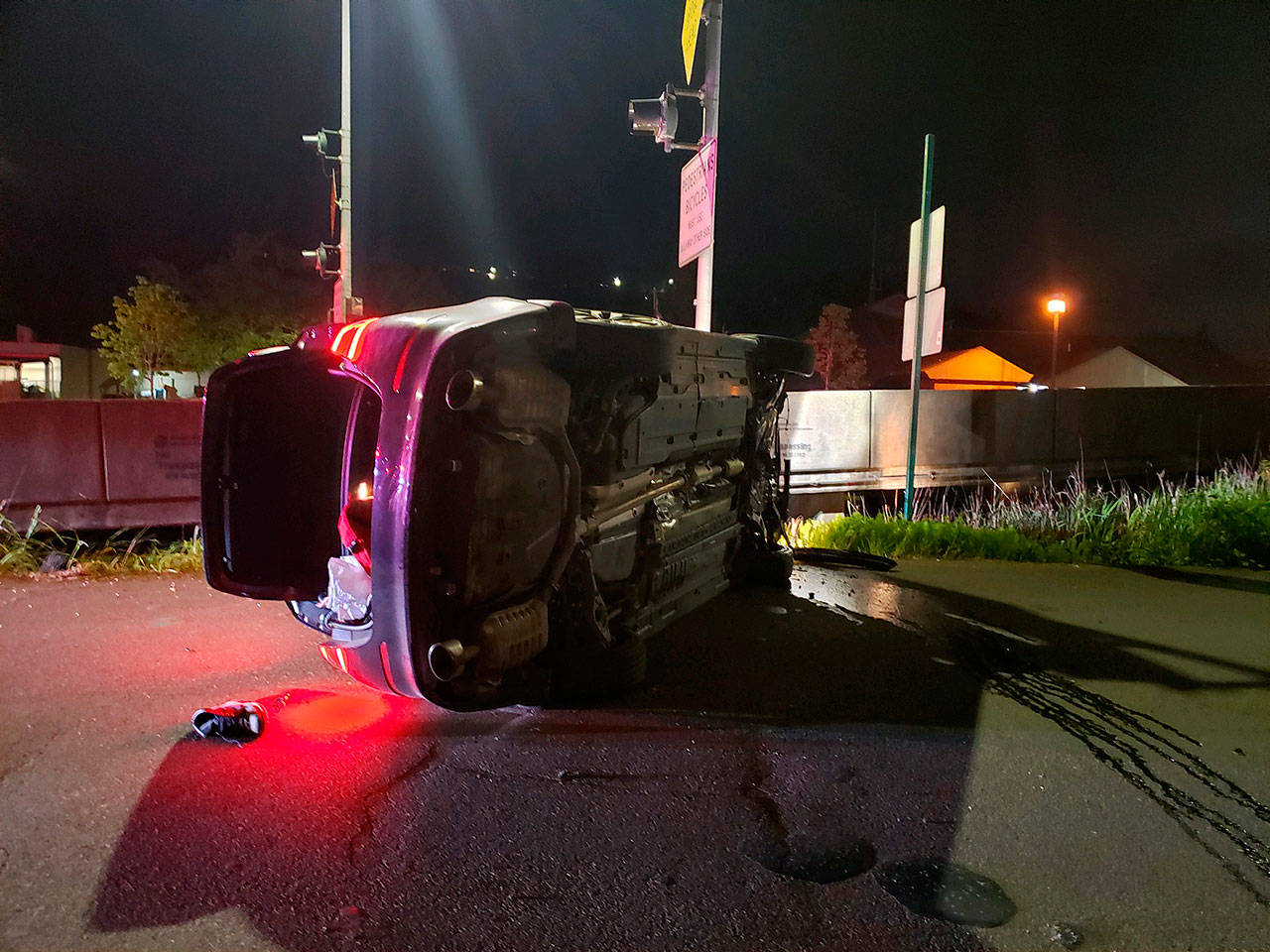 Courtesy Hoquiam Police Department                                A car rolled on its side near the Simpson Avenue Bridge Saturday night.