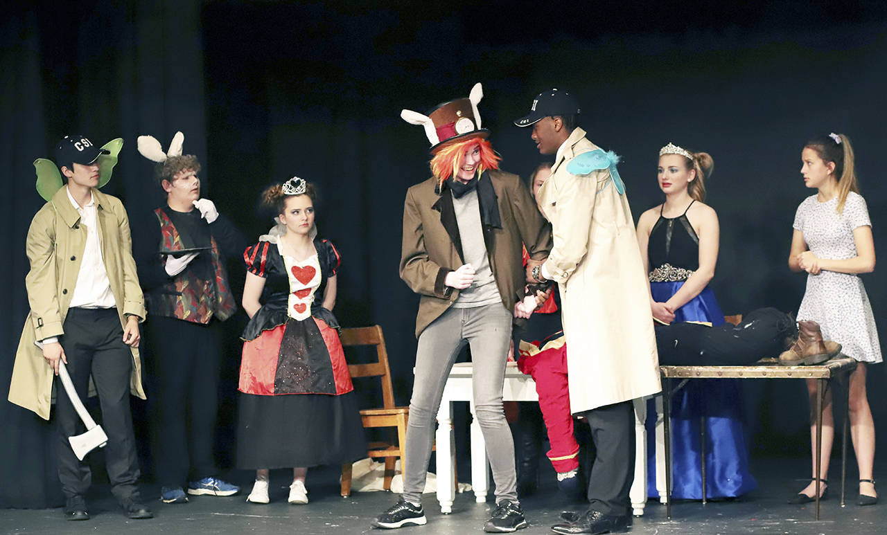 The South Bend High School Drama Club recently presented “CSI: Wonderland” to a packed house in Raymond’s historic Hannan Playhouse. A classic whodunit with fanciful Wonderland characters, a large cast of drama club actors entertained all in attendance. The investigation of who killed the King of Hearts had many twists and turns. From left are Tink (Nick Stamos), the White Rabbit (Max Richter), the Queen of Hearts (Chelsea Minks), the Mad Hatter (Karli Wilson), Murk (Cody Jones) and the Duchess of Diamonds (Hannah Byington).                                photo Courtesy Larry Bale