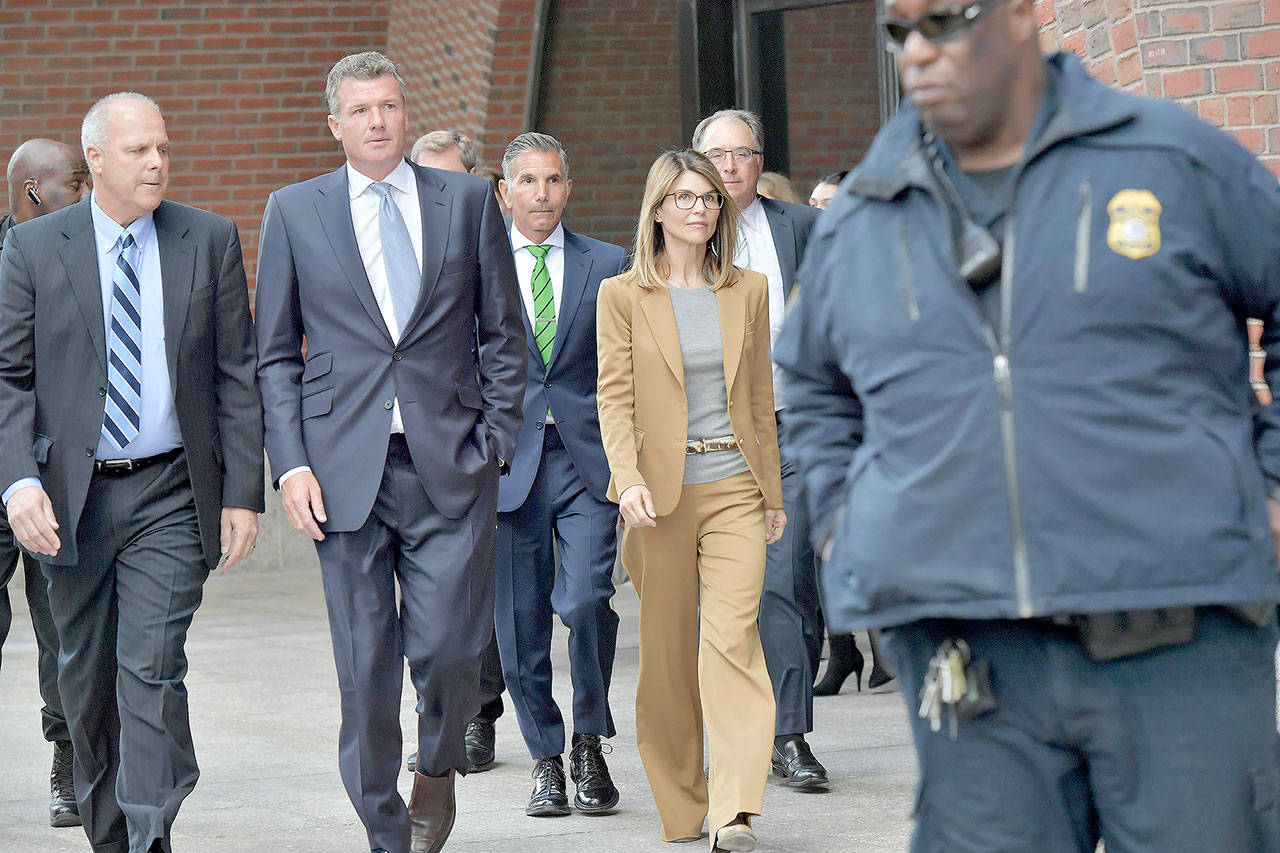 Lori Loughlin exits the U.S. courthouse in Boston after appearing in federal court on April 3 to answer charges stemming from college admissions scandal (Paul Marotta/Getty Images)