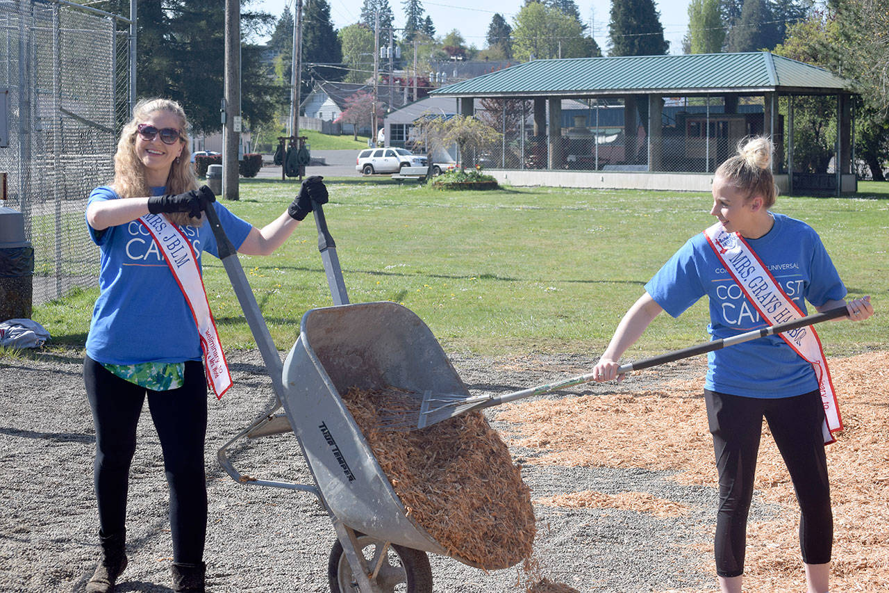 Photo courtesy Comcast Corp.                                Volunteers Mindy Dunn (left) and Brandi Jo Ross spread wood chips May 4 at McCleary’s Beerbower Park. The women were taking part in Comcast Corp.’s Comcast Cares Day.