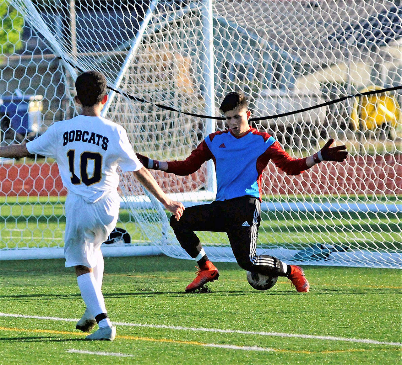Aberdeen’s Antonio Torres (10) gets his shot between the legs of Centralia keeper Jacob Fink to score a goal in the 11th minute on Thursday. (Hasani Grayson | Grays Harbor News Group)