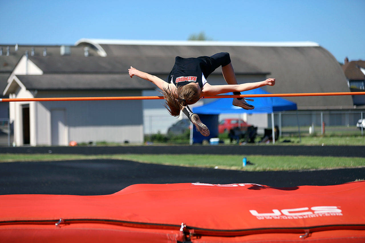 Raymond’s Kyra Gardner clears the bar en route to her victory in the girls high jump at the Pacific League Sub-District Finals on Friday at Raymond High School. (Photo by Larry Bale)